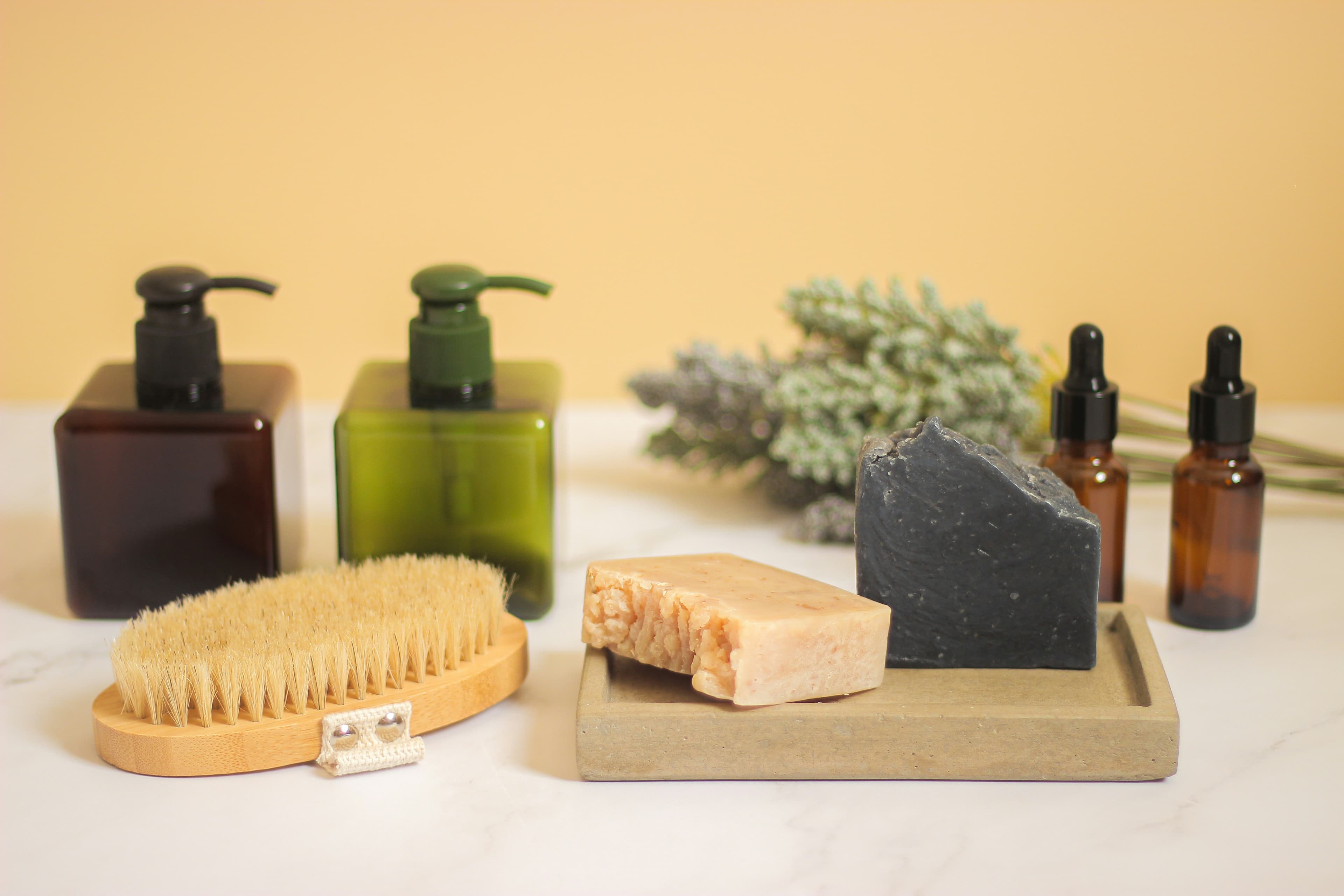 Soap bars curing on a wooden shelf in Janice's studio