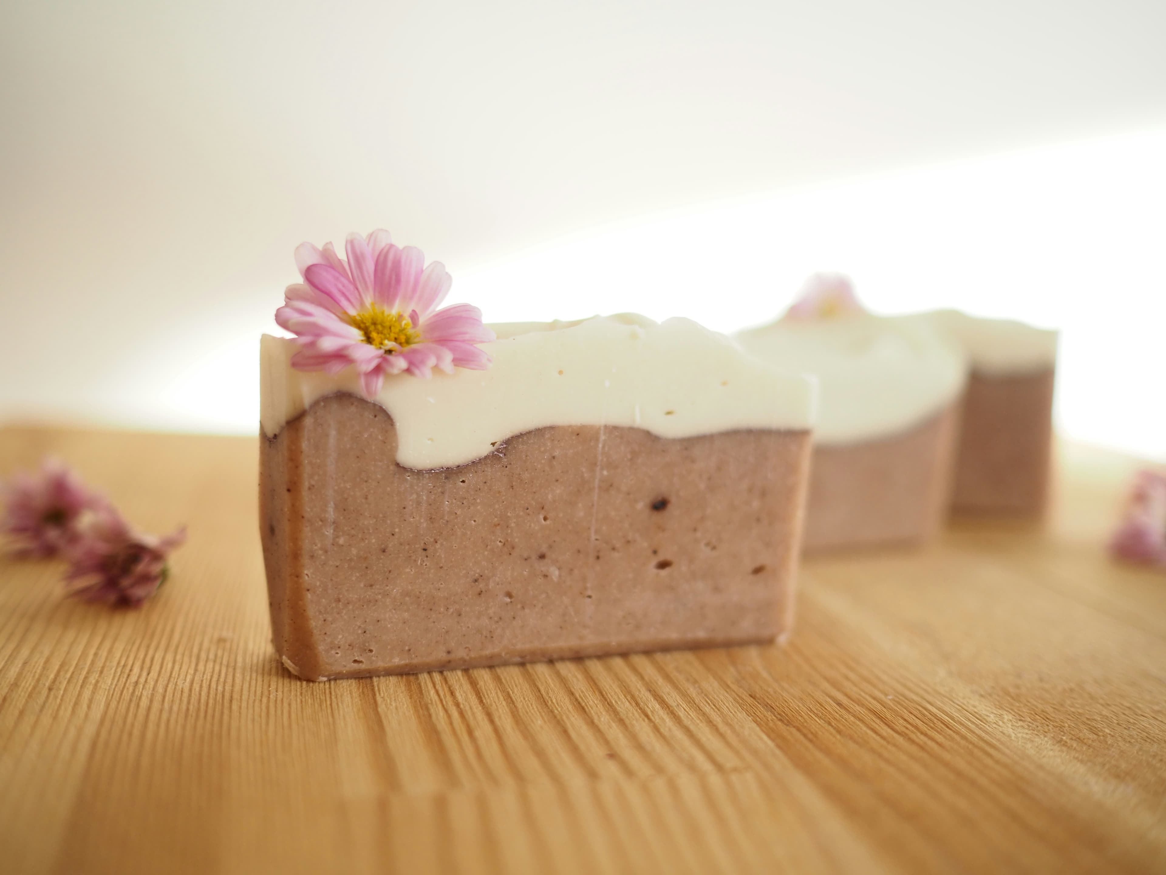 Awra & Co. soap collection arranged on a linen cloth